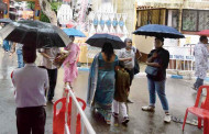 Revellers brave short spells of rain and turn out in numbers on Ashtami