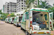 Road filled with hearses and ambulances