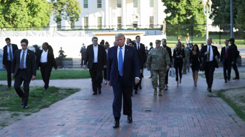 Trump walks from White House to riot-damaged church