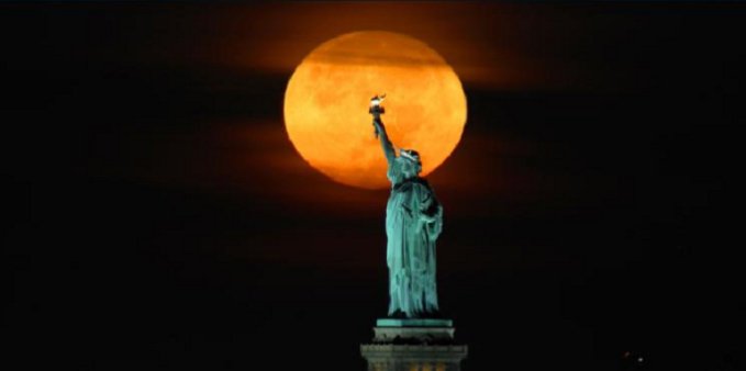 The harvest moon will glow an eerie orange color as it rises in the sky
